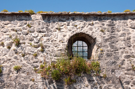 Medieval wall with small window