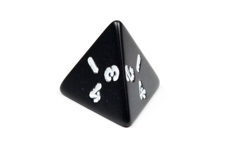 A single four-sided die  tetrahedron  on whiteの写真素材
