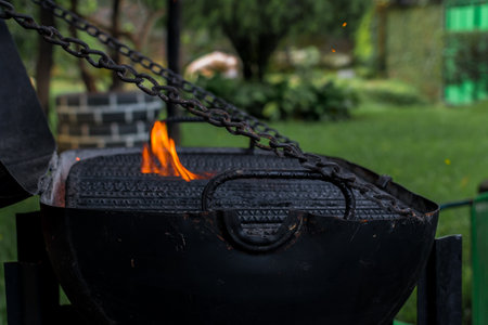 lighting the charcoal to make roast beef. grill with fireの写真素材