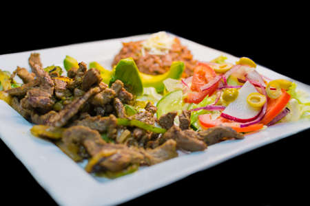 snack to eat with beer. meat, avocado, fresh salad, chirimolの写真素材