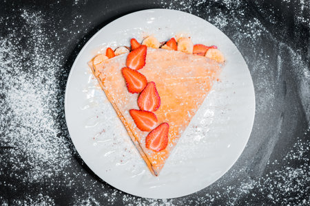 delicious crepe with strawberries top viewの写真素材