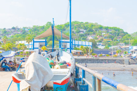 Photo of Puerto de la Libertad and Mercado del Mar with the restaurants on the shore and sunset park. surf townのeditorial素材