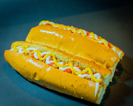 bread stuffed with soy meat seasoned with fresh salad, mayonnaise and mustard. typical street food, salvadoran and latin americanの写真素材