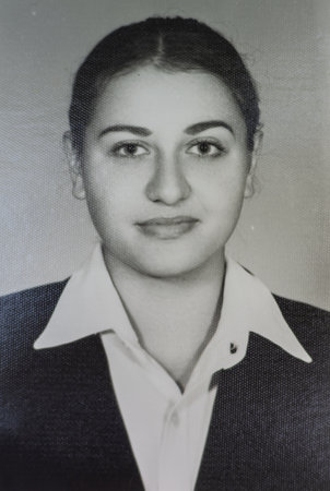 Old black and white photograph on photographic paper. Example of a passport photo. female model with a white background. example of a photograph of a degree certificateの写真素材
