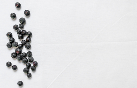 Flat lay top view of colorful blueberries against colorful background. Texture.の写真素材
