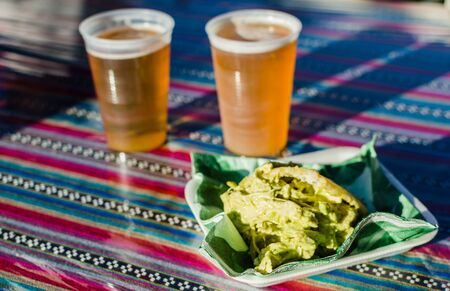 Venezuelan arepa with chicken and avocado filling at a street food marketの写真素材