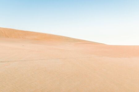 Dune in the desert with yellow sand. Selective focus