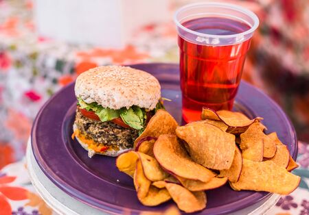 Vegetarian vegan burger and raspberry lemonade at a street food marketの写真素材