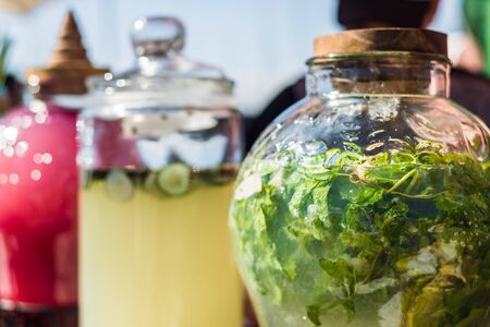 Selection of refreshing and colorful lemonades at a street food market