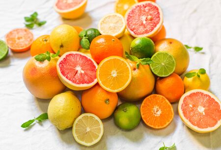 Colorful citrus fruit like lemon, lime, orange, grapefruit, tangerineの写真素材