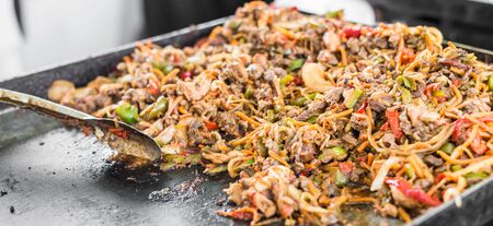 Taco ingredients cooking at a street food marketの写真素材