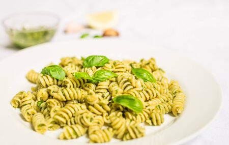 Pasta with basil and cheese pesto against white backgroundの写真素材