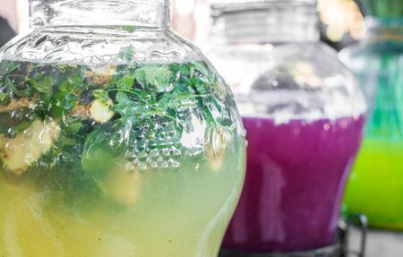 Selection of refreshing and colorful lemonades at a street food marketの写真素材