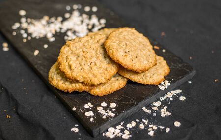 Peanut butter oatmeal cookies against black backgroundの写真素材
