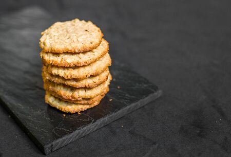 Peanut butter oatmeal cookies against black backgroundの写真素材