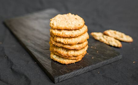 Peanut butter oatmeal cookies against black backgroundの写真素材