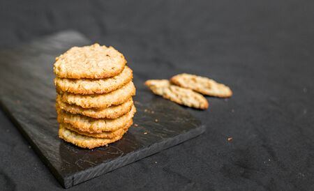 Peanut butter oatmeal cookies against black backgroundの写真素材