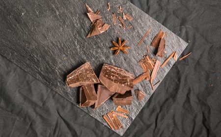 Chocolate with chocolate chips against black background.の写真素材