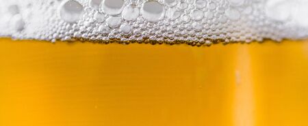 Beer and foam bubbles colorful food and drink background.