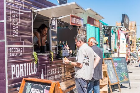 Buenos Aires, Argentina - November 11, 2017: People at a street food marketのeditorial素材