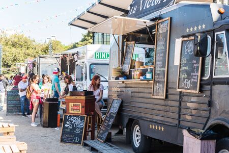 Buenos Aires, Argentina - November 25, 2017: People at a street food marketのeditorial素材