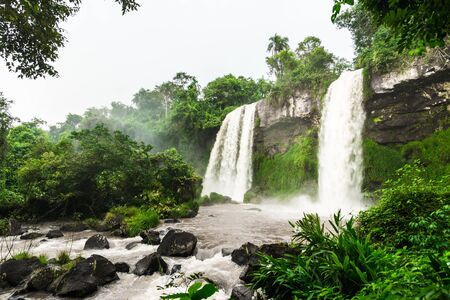Wide angle landscape view of Iguazu falls waterfalls on a sunny day in summer.の写真素材