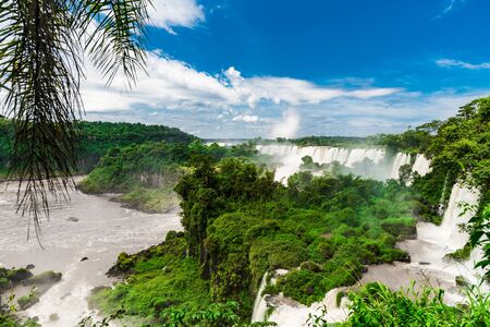 Wide angle landscape view of Iguazu falls waterfalls on a sunny day in summer.の写真素材