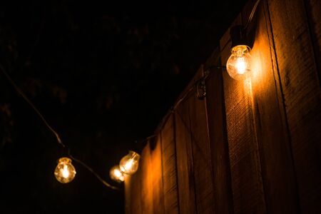 Vintage antique hanging light bulbs at a street food market.の写真素材