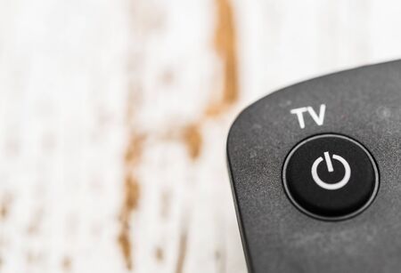 Smart tv remote control with power button. Concept of entertainment, fun, news.の写真素材