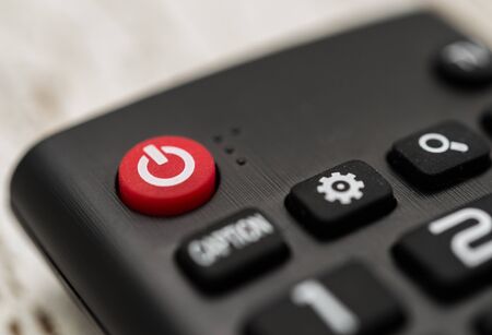 Smart tv remote control with power button. Concept of entertainment, fun, news.