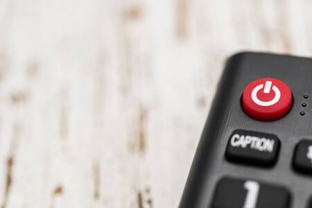 Smart tv remote control with power button. Concept of entertainment, fun, news.