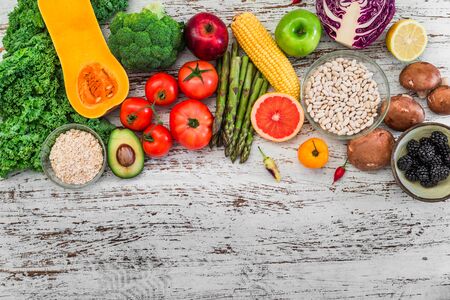 Fresh organic fruit and vegetables, white beans, oatmeal, and blackberriesの写真素材