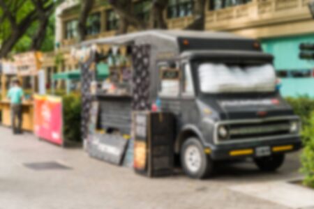 Food trucks at a street food market, blurred on purposeの写真素材