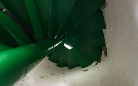 Spiral winding stairs staircase in an old tower buildingの写真素材