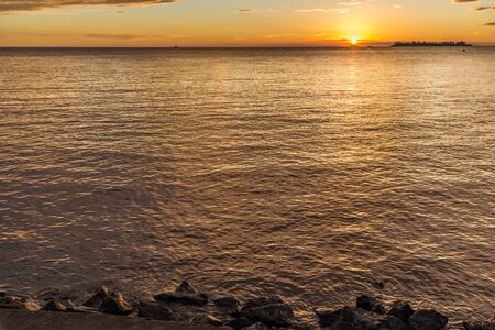 Landscape nature of sunset sky at the beach and colorful shiny sea oceanの写真素材