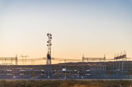 Electricity power tower line pylons at the sunriseの写真素材