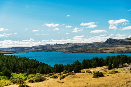 Landscape of blue lakes, Andes mountains, and forest in Patagonia, Argentinaの写真素材