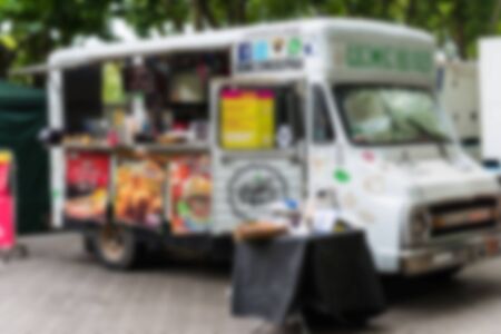 Food trucks at a street food market, blurred on purpose.の写真素材