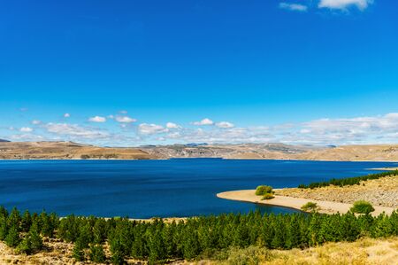 Landscape of blue lakes, Andes mountains, and forest in Patagonia, Argentinaの写真素材