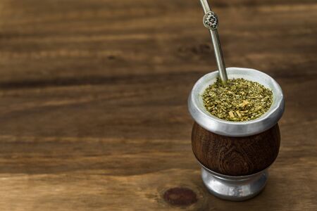 Traditional Argentinian yerba mate tea in a calabash gourd .の写真素材