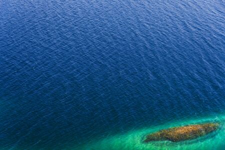 Blue turquoise transparent water surface. Pattern and backgroundの写真素材
