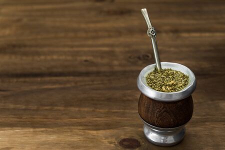 Traditional Argentinian yerba mate tea in a calabash gourd .の写真素材