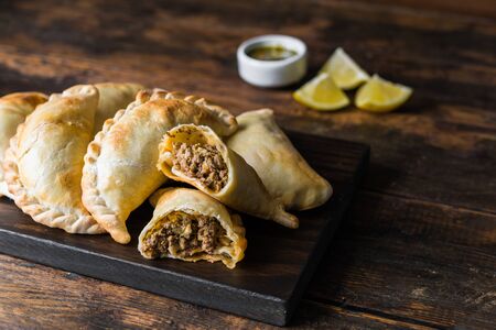 Traditional baked Argentine empanadas savoury pastries with beef stuffingの写真素材
