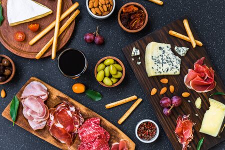 Table of antipasti and appetizers with cold meats and cheese deli platterの写真素材