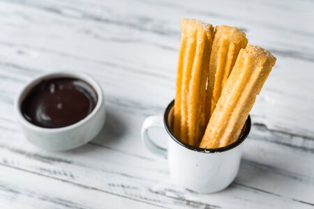 Churros with chocolate, a traditional Spanish sweet food pastry dessertの写真素材