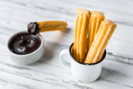 Churros with chocolate, a traditional Spanish sweet food pastry dessertの写真素材