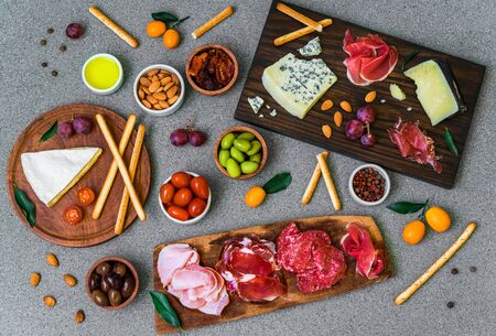 Table of antipasti and appetizers with cold meats and cheese deli platterの写真素材