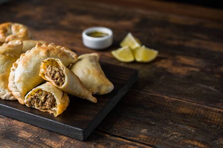 Traditional baked Argentine empanadas savoury pastries with beef stuffingの写真素材