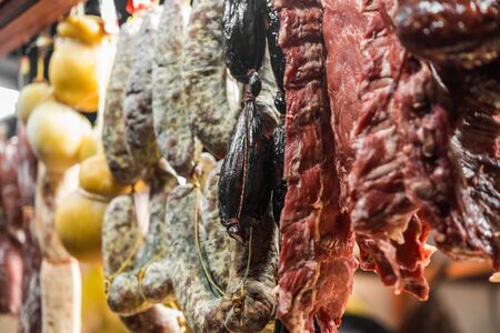 Traditional Italian delicatessen salami and other sausage.の写真素材