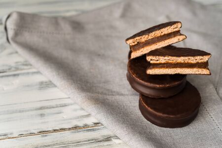 Alfajor with dulce de leche cake, Argentine dessert with chocolate and caramelの写真素材